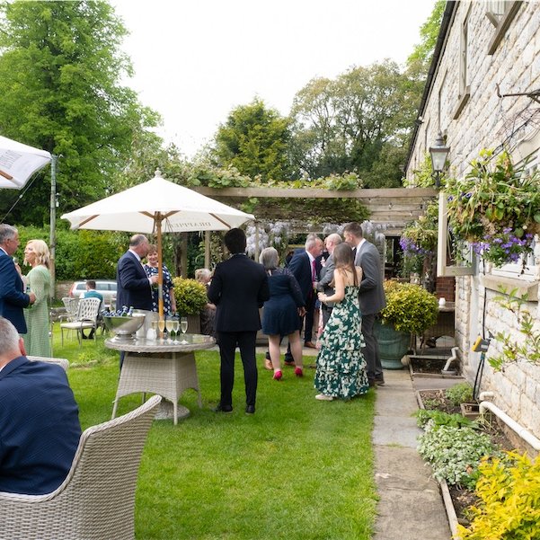 Wedding guests in the garden3
