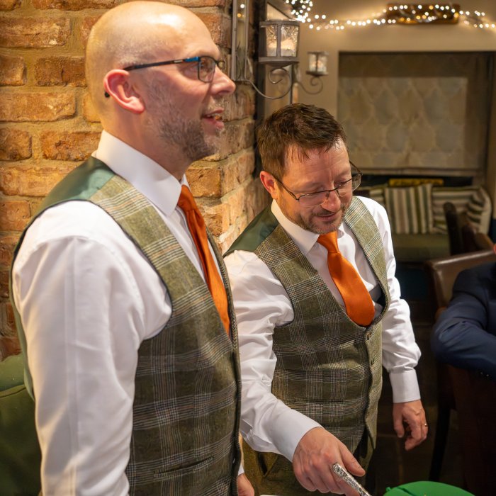 Phil and David prepare to cut the cake